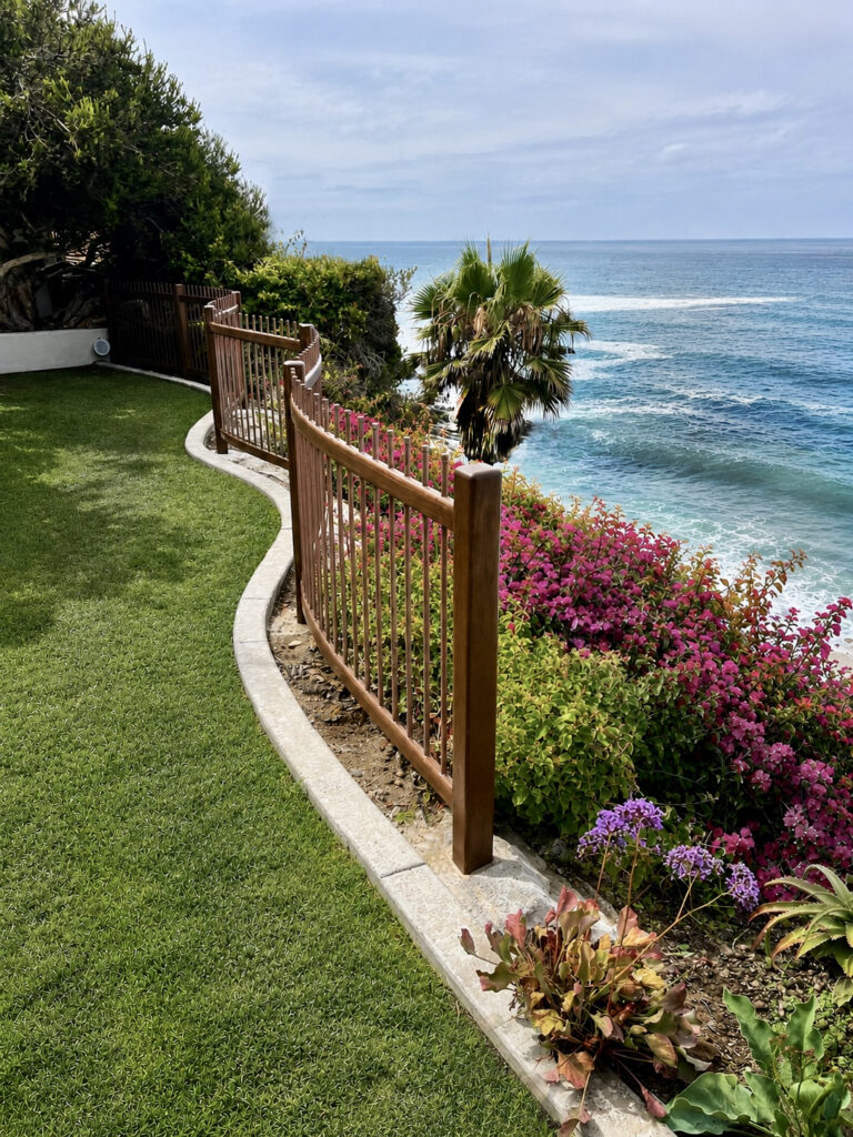 custom curved wood fence with copper pipe pickets